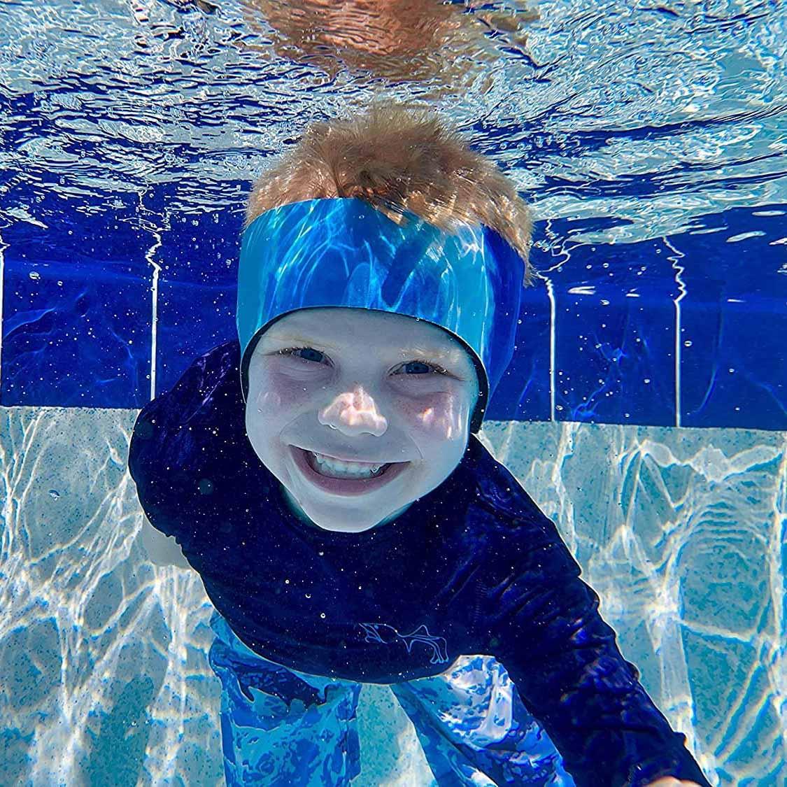 Child wearing a Tie Dye Blue swimming headband in a pool
